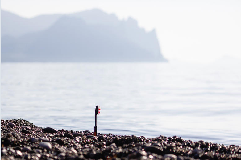 Toothbrush waste by the ocean