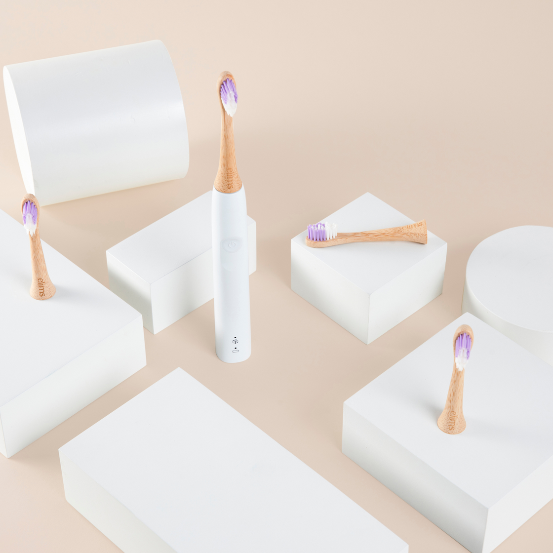 elims oral care's premium bamboo toothbrush heads shown on white blocks