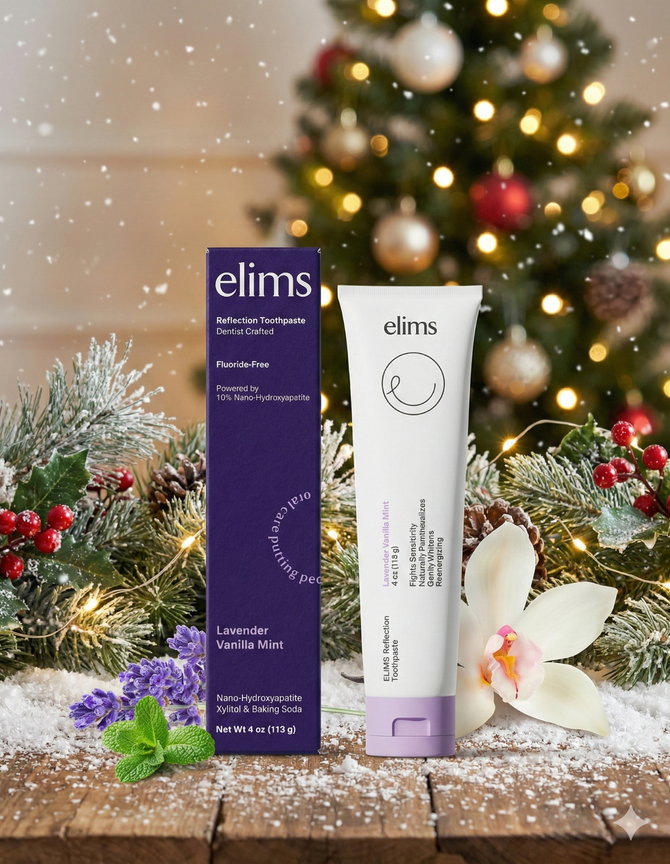 Elims toothpaste tube and packaging on a wooden surface with a Christmas tree in the background