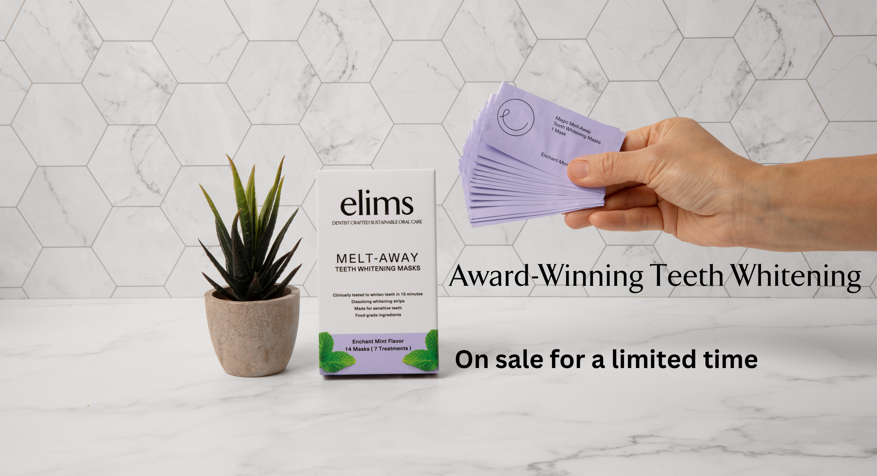 elims oral care award winning teeth whitening strips held by hand