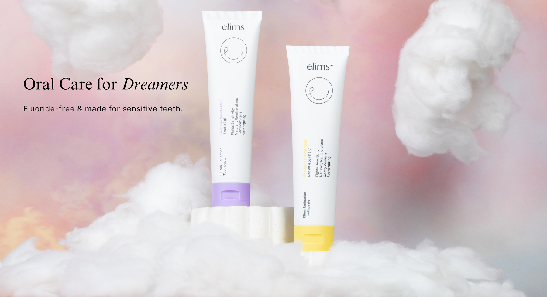 Two Elims nano-hydroxyapatite for sensitive teeth toothpaste tubes on a fluffy white surface with a soft pink background. one is lavender toothpaste and the other is fruit flavor toothpaste