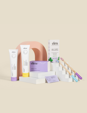 full line of elims oral care products on a beige background