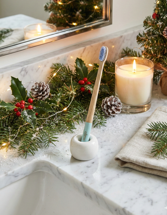 holiday image on a bathroom counter of elims bamboo toothbrush in blue